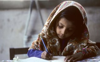 A young girl studying, representing the students INSARA Foundation plans to support through education